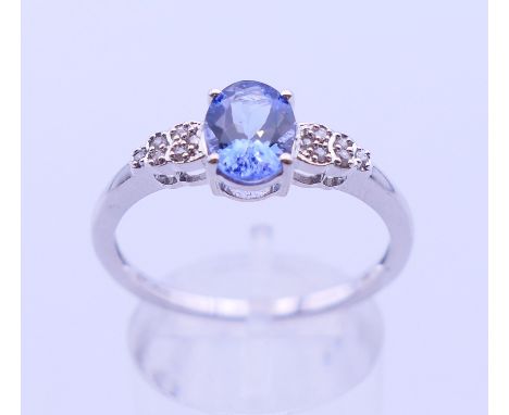A 10 K white gold tanzanite ring. Ring size U.