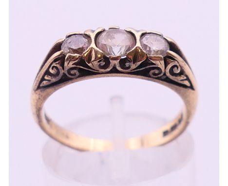 A 9 ct gold three-stone ring. 3.7 grammes total weight. Ring size M/N.