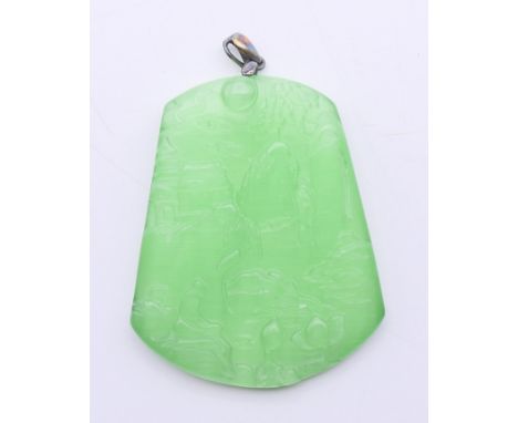 A silver-topped jade pendant. 5.25 cm high. 