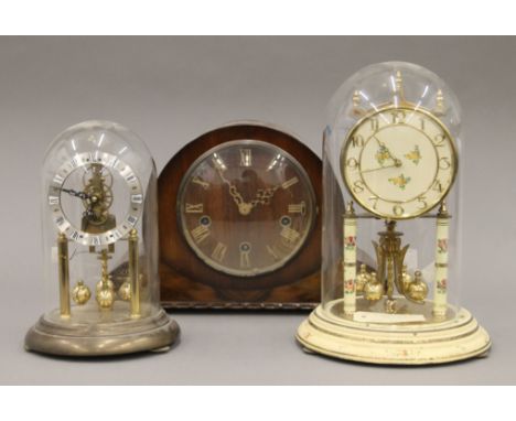 Two vintage anniversary clocks under glass domes and a Smith's mantle clock. The largest 28.5 cm high overall.