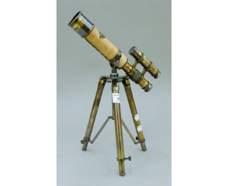 A telescope on a stand. 25 cm long.