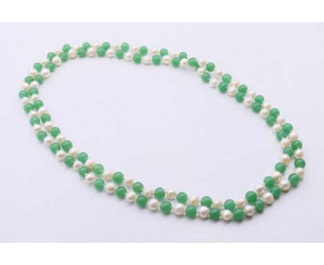 A string of alternating jade and pearl beads.  120 cm long, beads 8.5 mm.