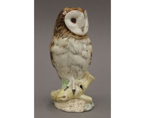 A Royal Doulton Whyte & Mackay scotch whisky decanter formed as a barn owl. Full and sealed. 17 cm high.