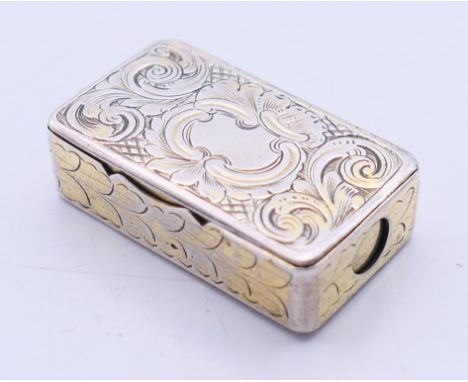 A silver vesta and cigar cutter with suspension loop. 3.25 cm x 2 cm.