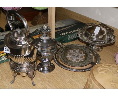 A plated oil lamp, a kettle on stand etc
