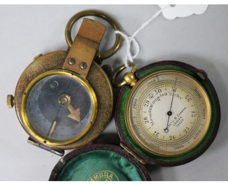 A WWI cased compass and a Negretti & Zambra pocket barometer