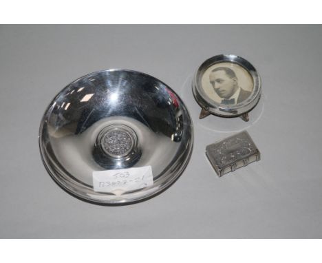 A Chinese white metal snuff box modelled as a book, a silver mounted photograph frame and an 800 silver bowl.