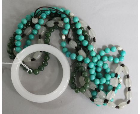 Three hardstone bead necklaces and a bangle.