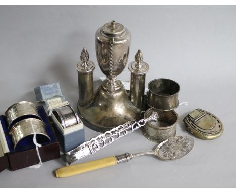 A pair of silver napkin rings, cased, sundry other silver napkin rings, plated items, including a cigar table lighter, etc.