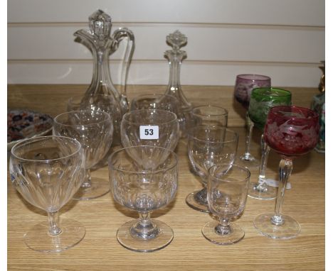 A collection of goblets, etched glassware and two decanters