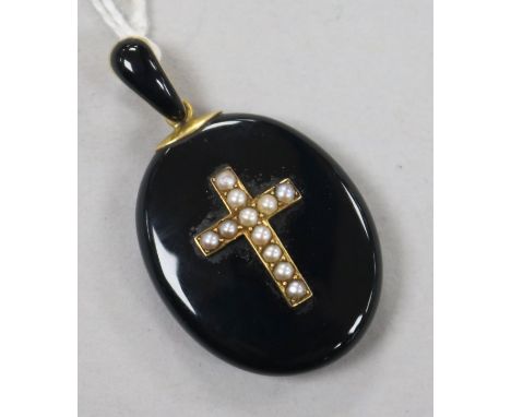 A Victorian gold enamel and seed pearl set oval mourning pendant locket, overall 41mm.