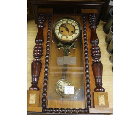 A wall clock and a mantel clock
