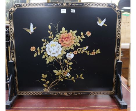 A Chinese black lacquered floral decorated fire screen W.93cm