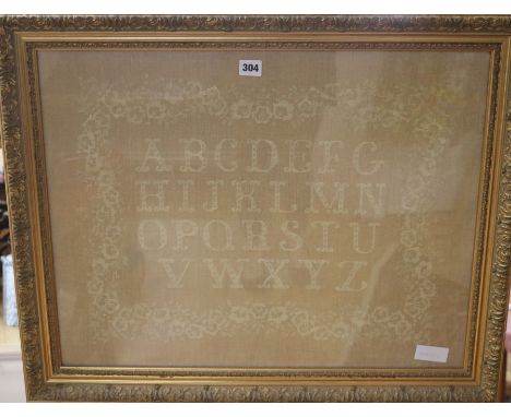A gilt framed tapestry