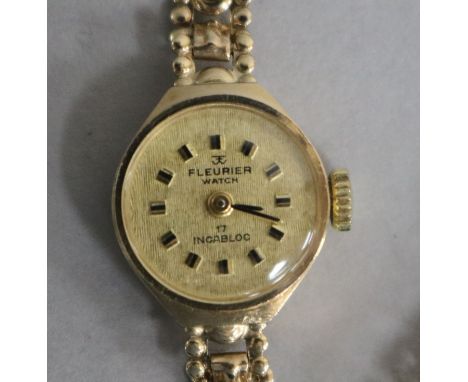A lady's 9ct gold Fleurier manual wind wrist watch, on a 9ct gold fancy link bracelet.