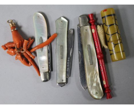 Three mother of pearl pen knives, a coral pendant, etc.