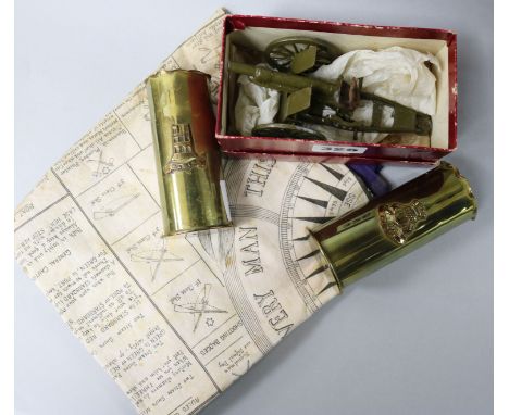 A Britains box artillery gun, two shells and a Military scarf