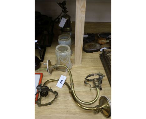 A pair of brass wall lights and a similar ceiling light with vaseline glass shades