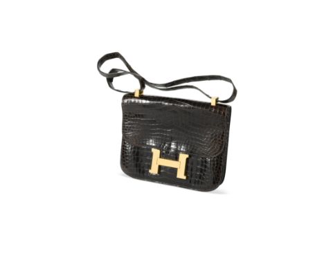 An Hermès brown crocodile leather Constance bag,with gilt H clasp, adjustable shoulder strap and the interior with one slip p