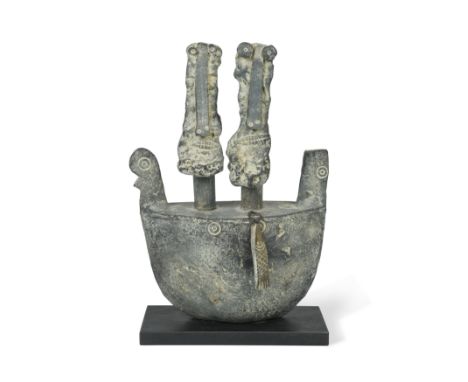 § John Maltby (British, 1936-2020), Two Fishermen and a Boat, 2009,a stoneware model of two stylised masks in a boat mounted 