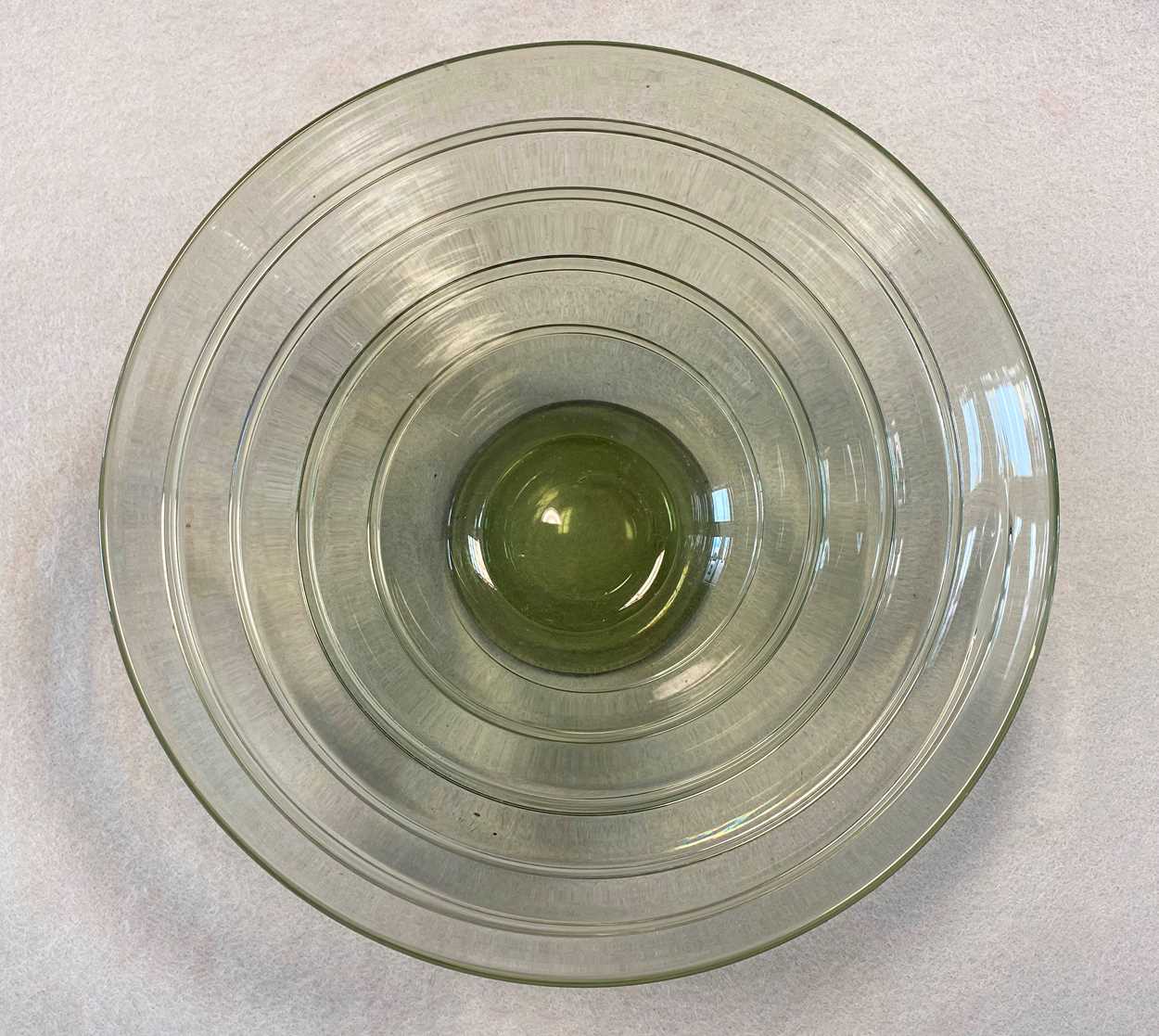 Barnaby Powell for Whitefriars, a ribbon trailed green glass bowl ...