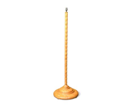 A 1920s blonde wood standard lamp,with bobbin turned column and circular base 163cm high
