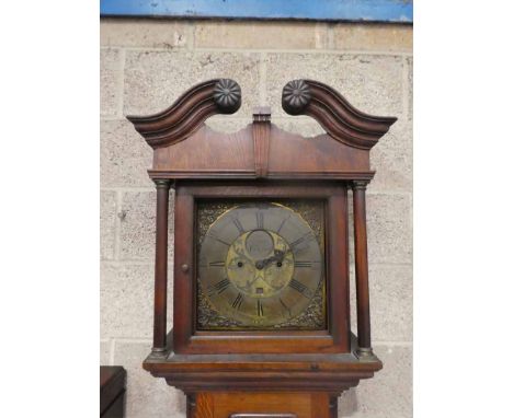 A late 18th century oak Longcase Clock, broken arch pediment with carved rosettes, 12 square brass dial with Roman and Arabic