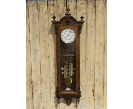 A 19th century mahogany cased Vienna style Wall clock, two weight eight day chiming movement, white enamel two part dial with