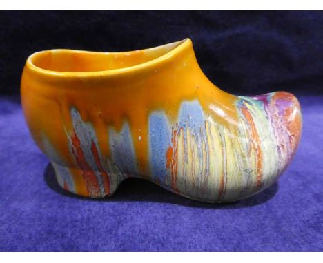 A Clarice Cliff Delecia pottery Clog, polychrome enamelled in dribbled glaze, 14cm long 