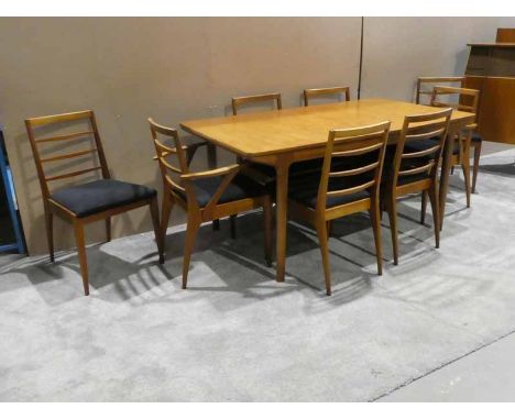 A H McIntosh &amp; Co Ltd, a 1970's teak extending Dining Table, rectangular top opens to reveal two folding leaves, on taper