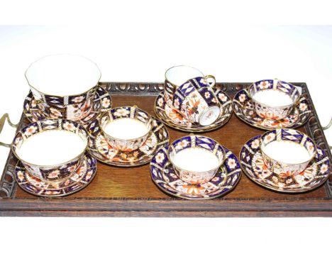 Six Royal Crown Derby cups and saucers, two sugar bowls and three plates