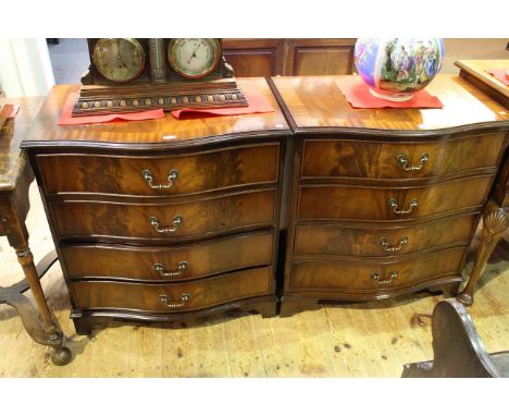 Pair crossbanded mahogany four drawer serpentine front chests on bracket feet