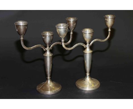 Near pair of silver three-light candelabra