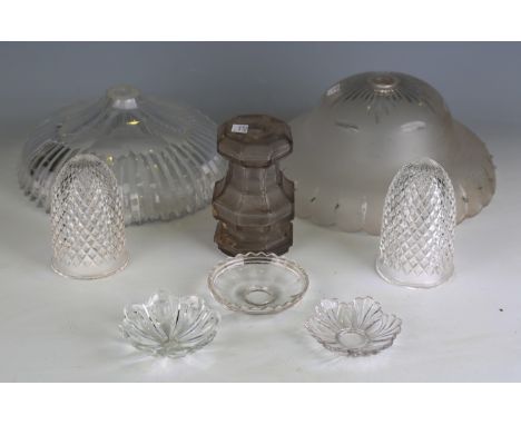 A large collection of cut and moulded glass light fittings, including shades, drops, sconces and other glass fittings.Buyer’s