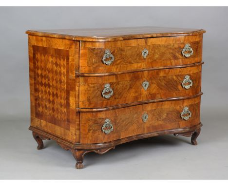 An 18th century Dutch walnut and parquetry veneered serpentine fronted three-drawer commode, the top and sides with inlaid ch