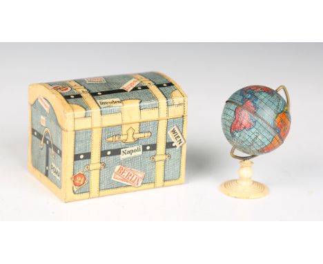 An early 20th century printed tinplate miniature table globe-on-stand, height 5.5cm, a 'Machinery Grease' pressed brass adver