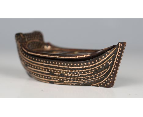 An unusual 19th century tortoiseshell and gold piqué inlaid novelty snuff box, modelled in the form of a boat with hinged lid