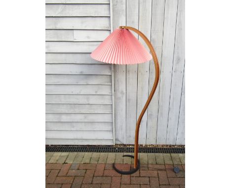 A Danish floor lamp by Mads Caprani, c1970's, stamped to iron base, laminated wood stem, red pleated shade. 152cm high 