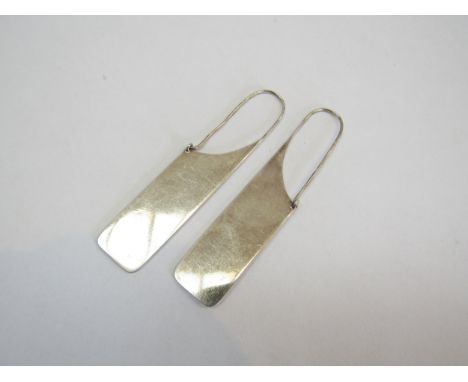 A pair of 1970's/80's large white metal 'Paperclip' earrings, unmarked. 