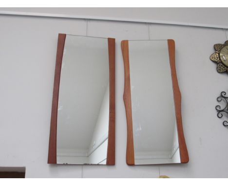 Two teak side framed wall mirrors, approx 79cm x 36cm and a 1970's brown plastic circular wall mirror, 52cm diameter 