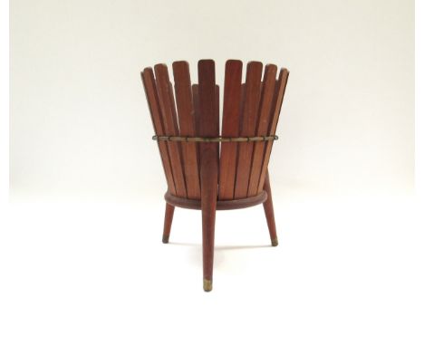 A vintage 1960’s wooden waste basket on pedestal legs with original £2 10 shillings price label to base. 27.5cm tall &nbsp; 