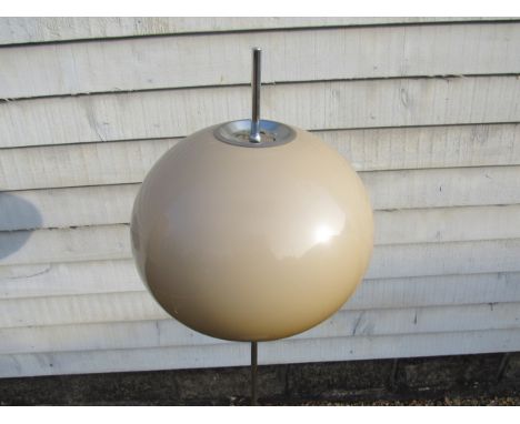 A chromed metal standard lamp with mushroom domed plastic shade, circular base 