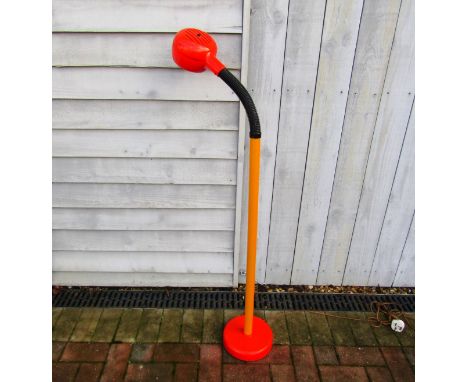 A 1970'S AB Fagerhults standard lamp in orange and yellow with single adjustable light 