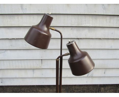 A Danish standard lamp in brown painted metal finish with twin adjustable spot lights 