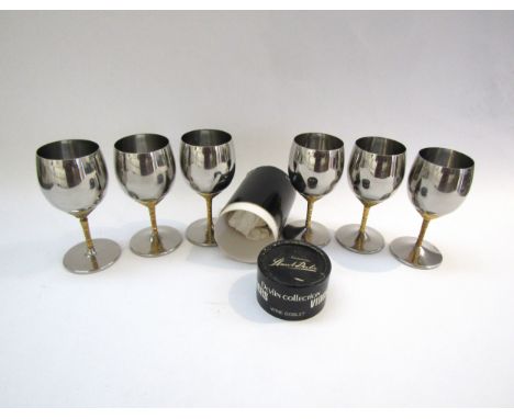 A set of six Viners goblets in stainless steel and gilded metal designed by Stuart Devlin, 14cm high, together with an origin