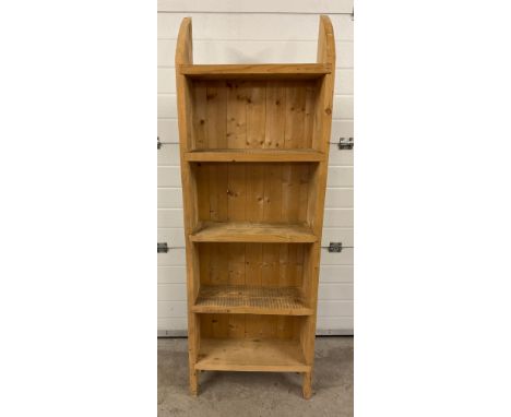 A modern rustic pine 4 shelf slimline set of shelves with curved top and shaped base. Approx. 178cm tall x 60.5cm wide. 