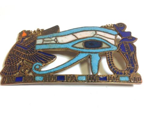 An Art Deco enamel, pendant brooch with an Egyptian design. Measures; 7.5cm x 4.5cm.   