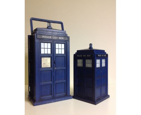 A working battery operated Dr Who Tardis with flashing light and noise plus another Tardis container. 