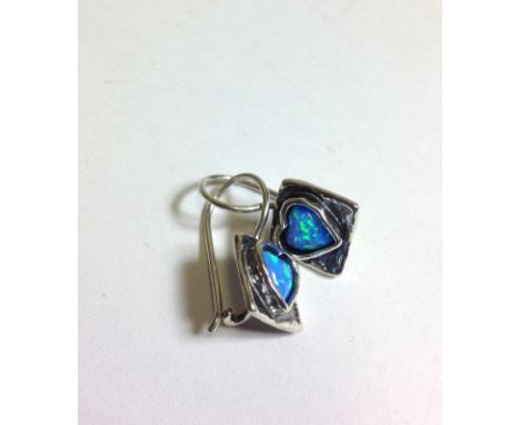 A pair of square design 925 silver earrings, each set with a heart shaped Opal.  