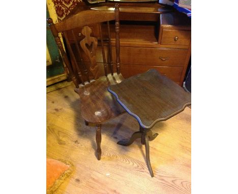 A wooden kitchen chair with a tripod table.